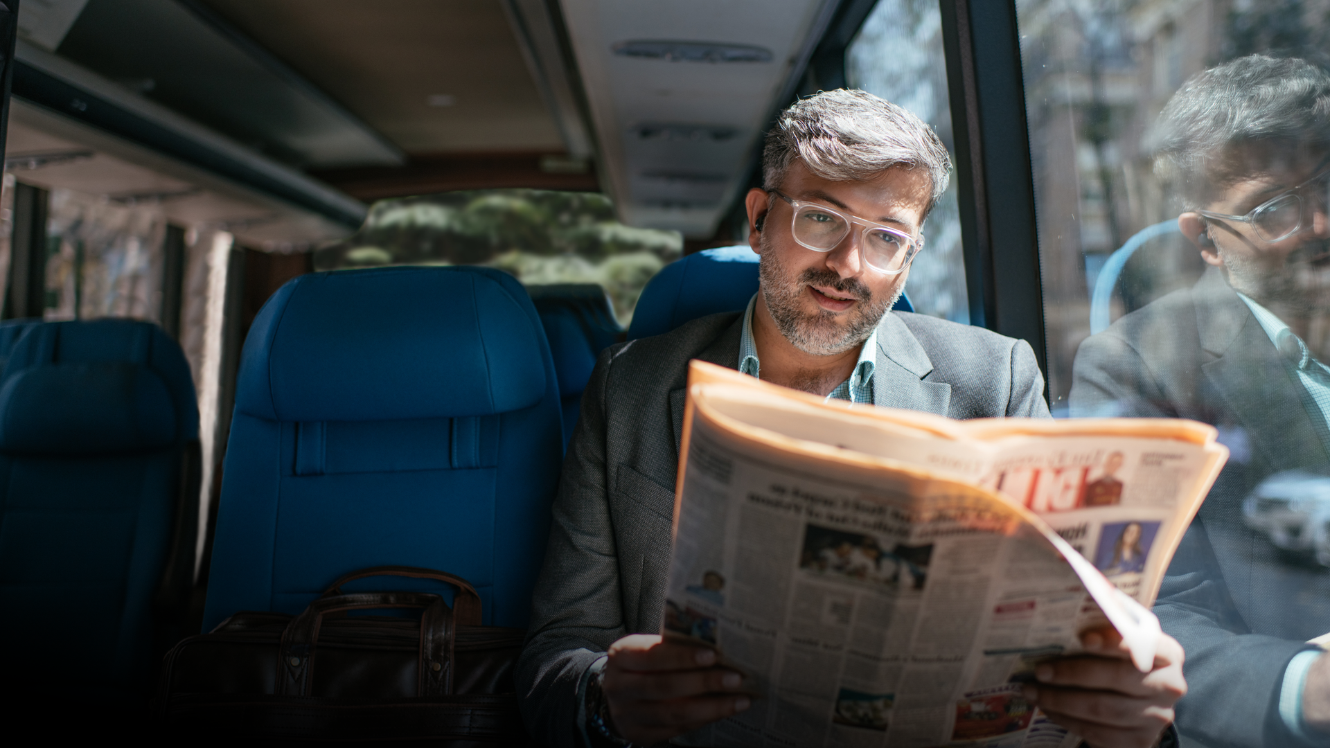 A Cityflo corporate bus with working professionals in Mumbai, on their way to Worli.