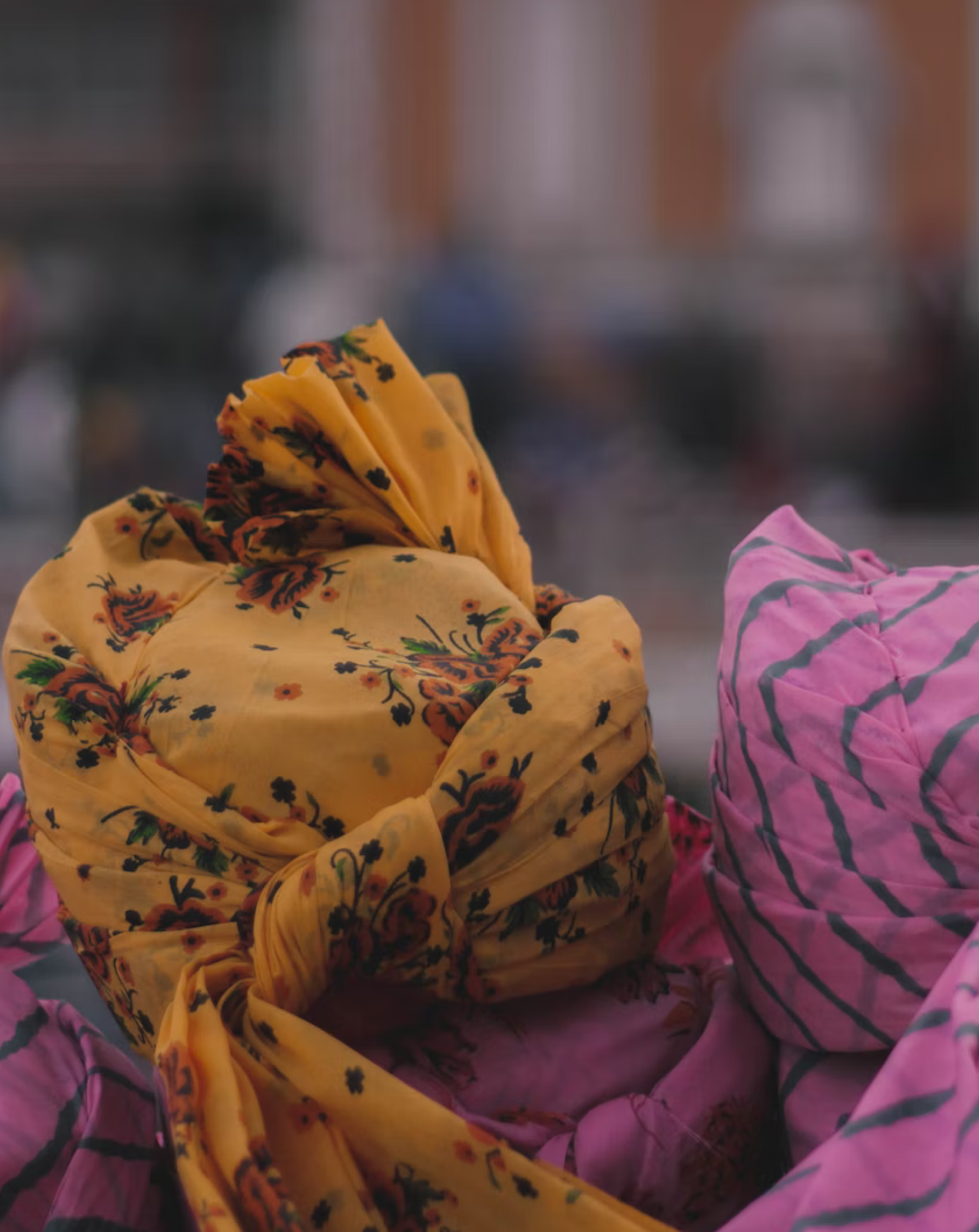 A pair of turbans at a wedding.